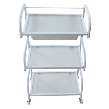 White metal serving cart with three shelves on a white background