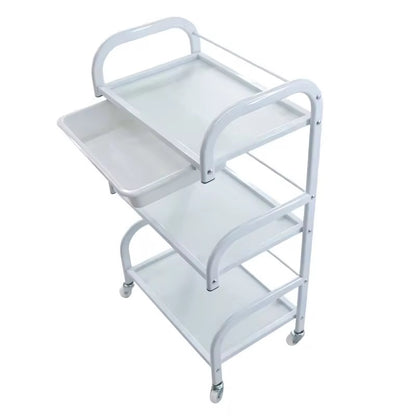 White metal serving cart with three shelves on a white background