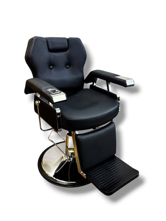 Black barber chair with reclining feature on a white background