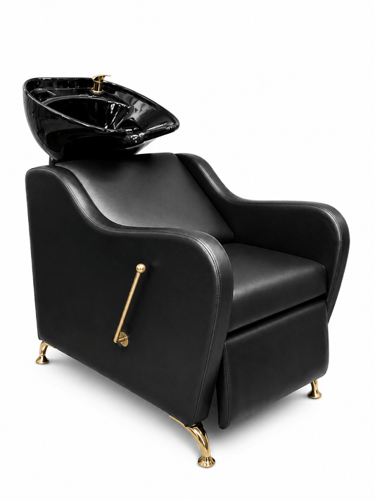 Black salon chair with gold accents and a matching black basin on a white background